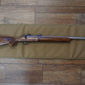 Cooper Arms Model 21 .223 AI bolt-action rifle with 24" stainless barrel, Leupold bases, reloading dies and brass — used excellent