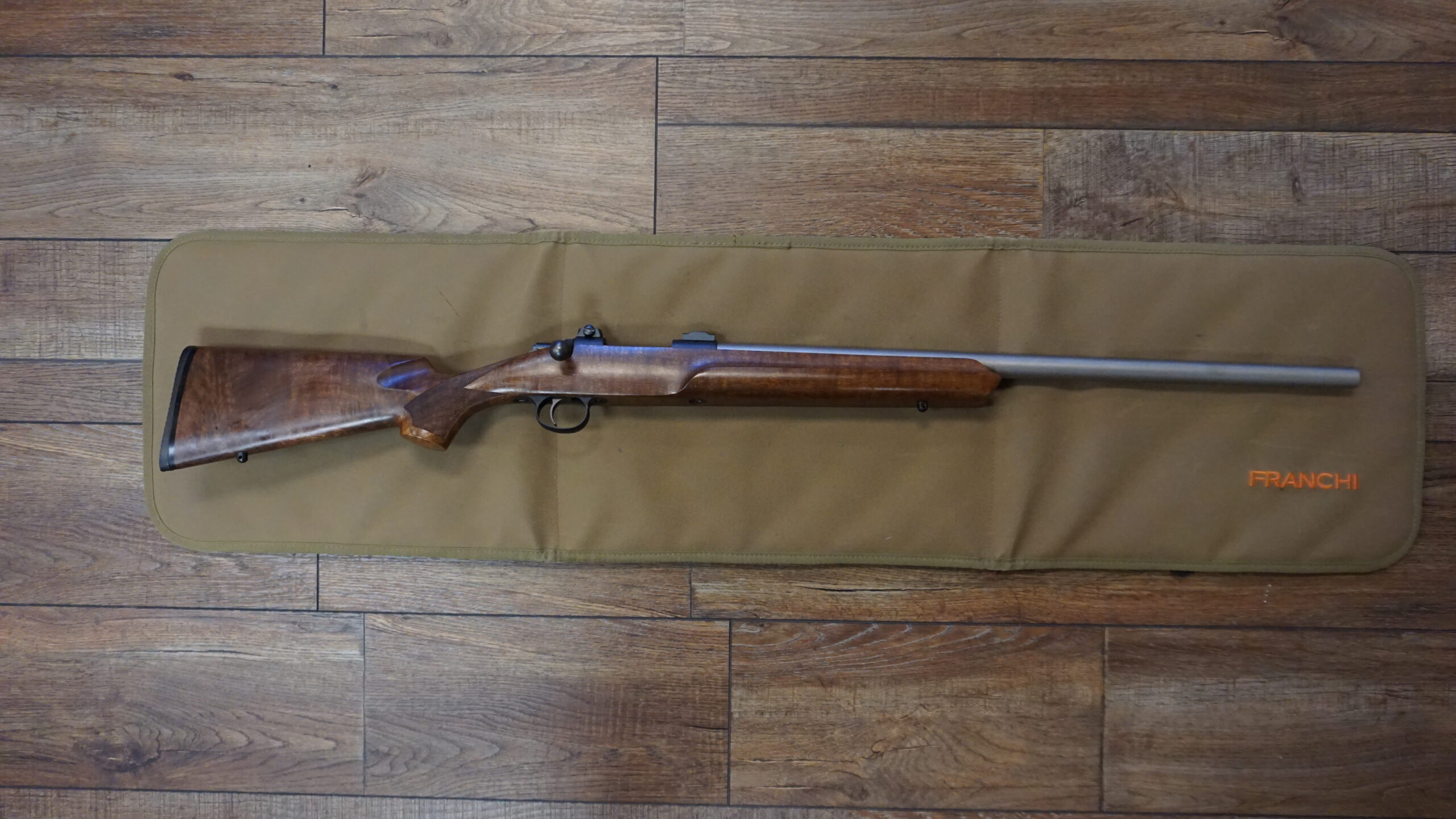 Cooper Arms Model 21 .223 AI bolt-action rifle with 24" stainless barrel, Leupold bases, reloading dies and brass — used excellent