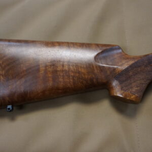 Cooper Arms Model 21 .223 AI bolt-action rifle with 24" stainless barrel, Leupold bases, reloading dies and brass