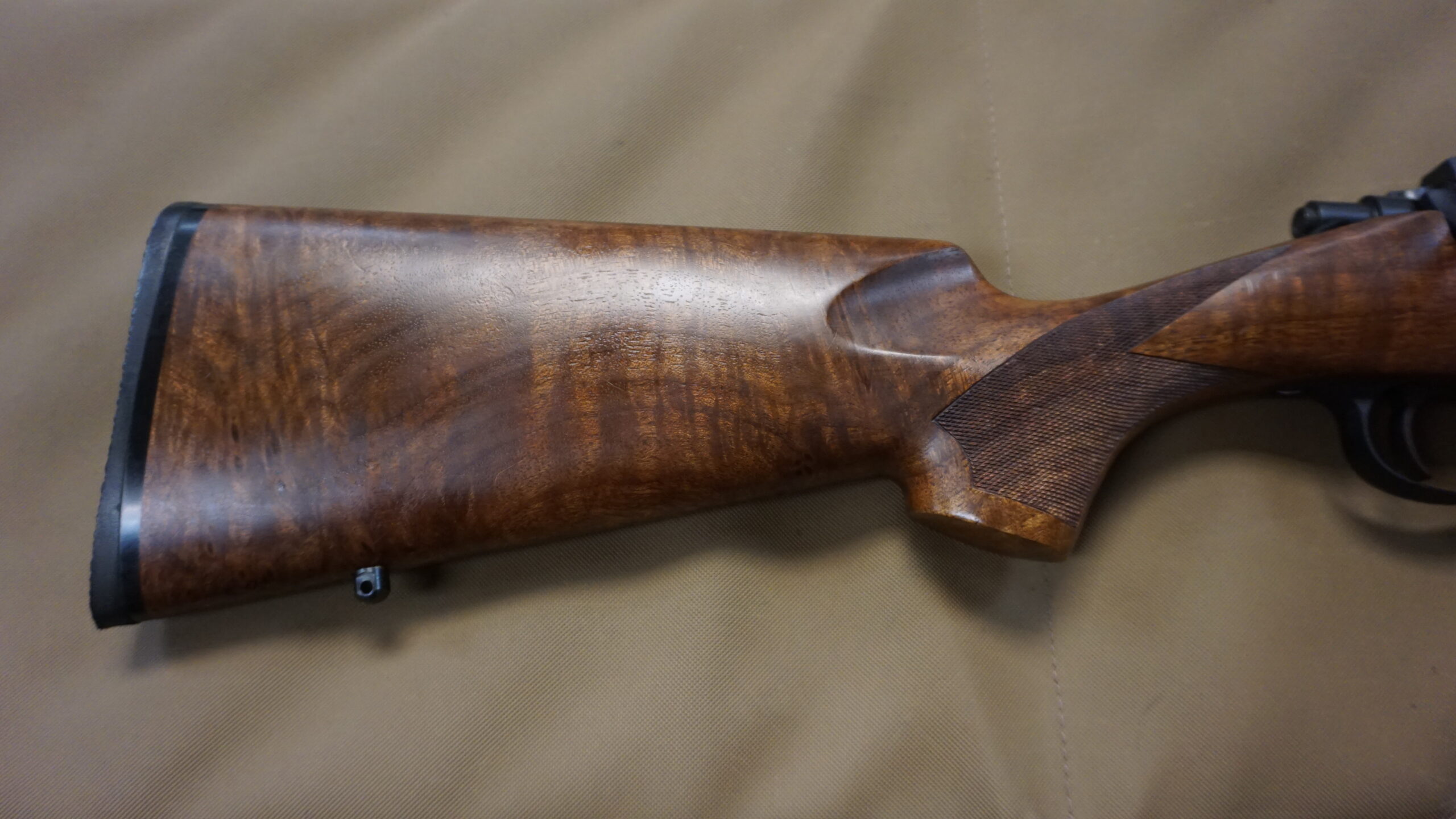 Cooper Arms Model 21 .223 AI bolt-action rifle with 24" stainless barrel, Leupold bases, reloading dies and brass